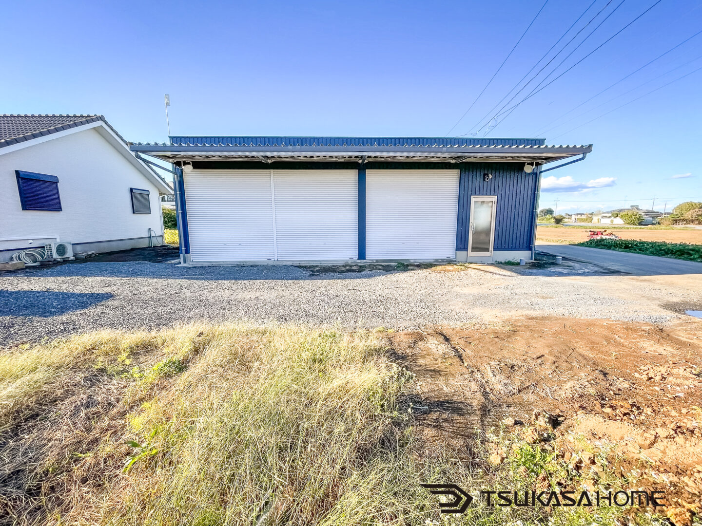 茨城県筑西市の黒い鉄骨作業場兼事務所外観施工事例　3台駐車