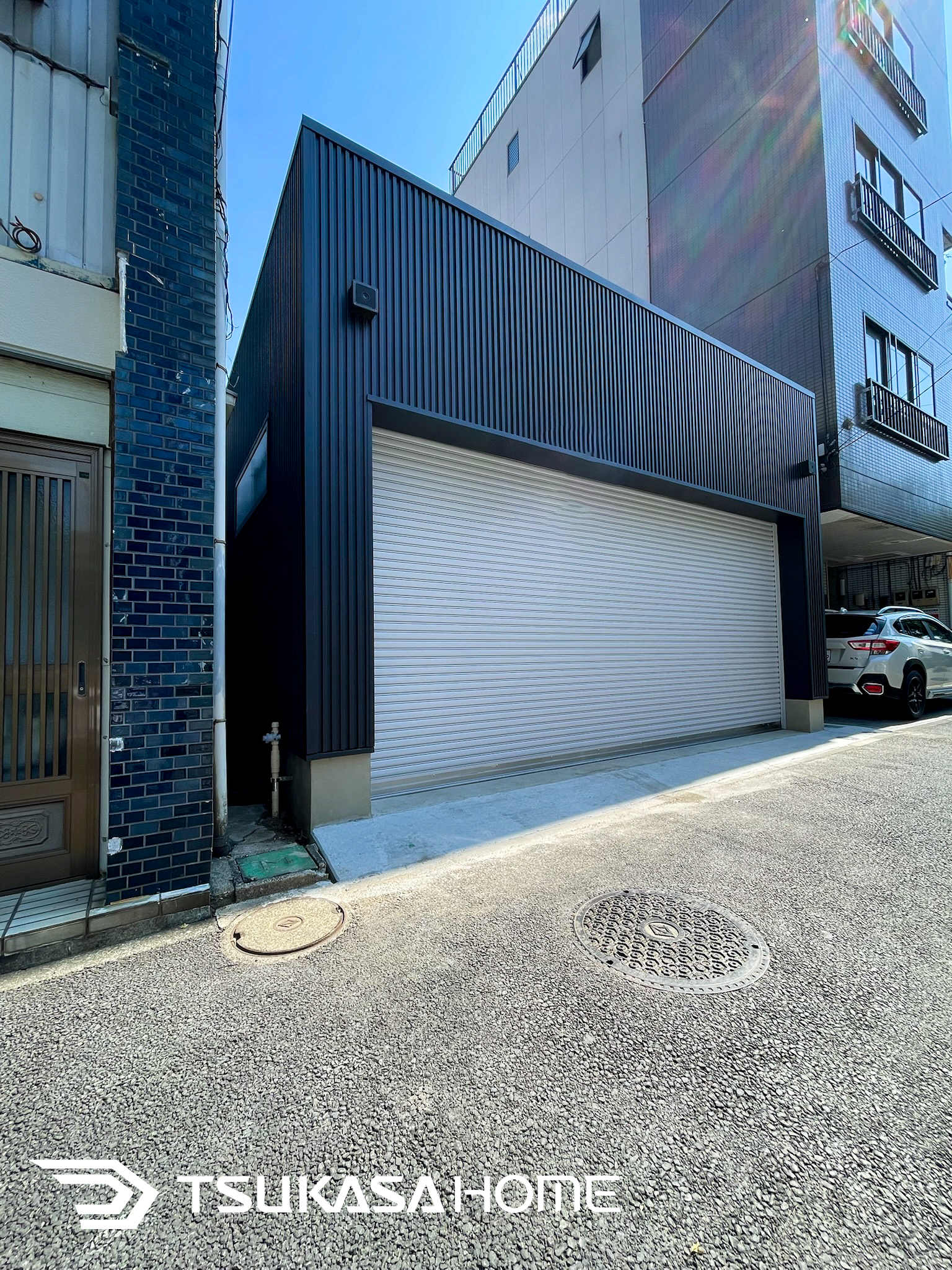 神奈川県横浜市西区で施工したおしゃれでかっこいい防火地域対応の2台駐車の黒い車庫ガレージ倉庫